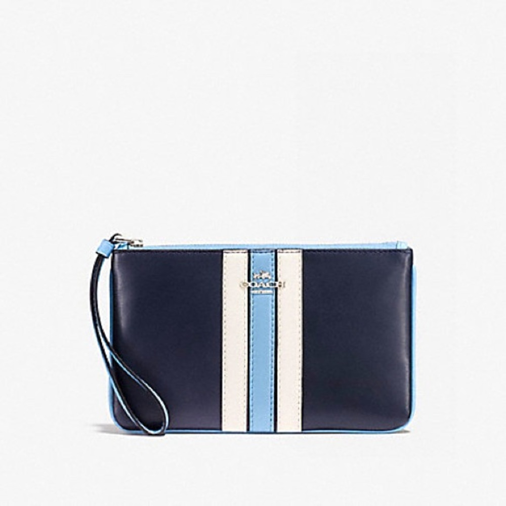 Coach blue varsity wristlet authentic, barely used, in great condition